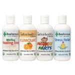 Four Balence Hair Conditioner bottles—Monkey Farts, Kumquat, Stress Relief, and Healing Tree—arranged on a rustic wood counter with fresh citrus slices and greenery, soft morning light highlighting the natural formulas.