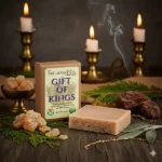 Balence Gift of Kings handmade soap on rustic wood with frankincense resin, myrrh chunks, cedar sprigs, sage leaves, and warm golden candlelight.