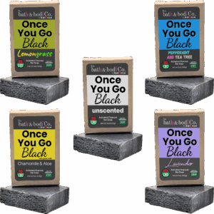 Balence Once You Go Black activated charcoal soap collection — solid black handmade bars with labels for Unscented, Lavender, Lemongrass, Peppermint & Tea Tree, and Chamomile & Aloe — displayed with herbs, flowers, and charcoal chunks on rustic wood.