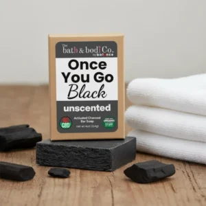 Balence Once You Go Black Unscented solid black soap bar with label, displayed with charcoal chunks and a folded white towel on rustic wood.
