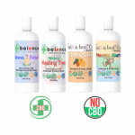 Four balence shampoo & body wash bottles — Healing Tree, Kumquat, Monkey Farts, and Stress Relief — displayed together on a white background.