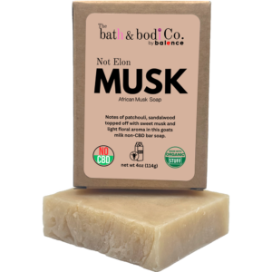 Not Elon MUSK African Musk goat milk bar soap by The bath & bodi Co. with boxed soap and bar displayed