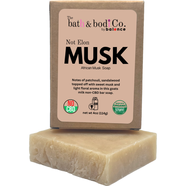 Not Elon MUSK African Musk goat milk bar soap by The bath & bodi Co. with boxed soap and bar displayed